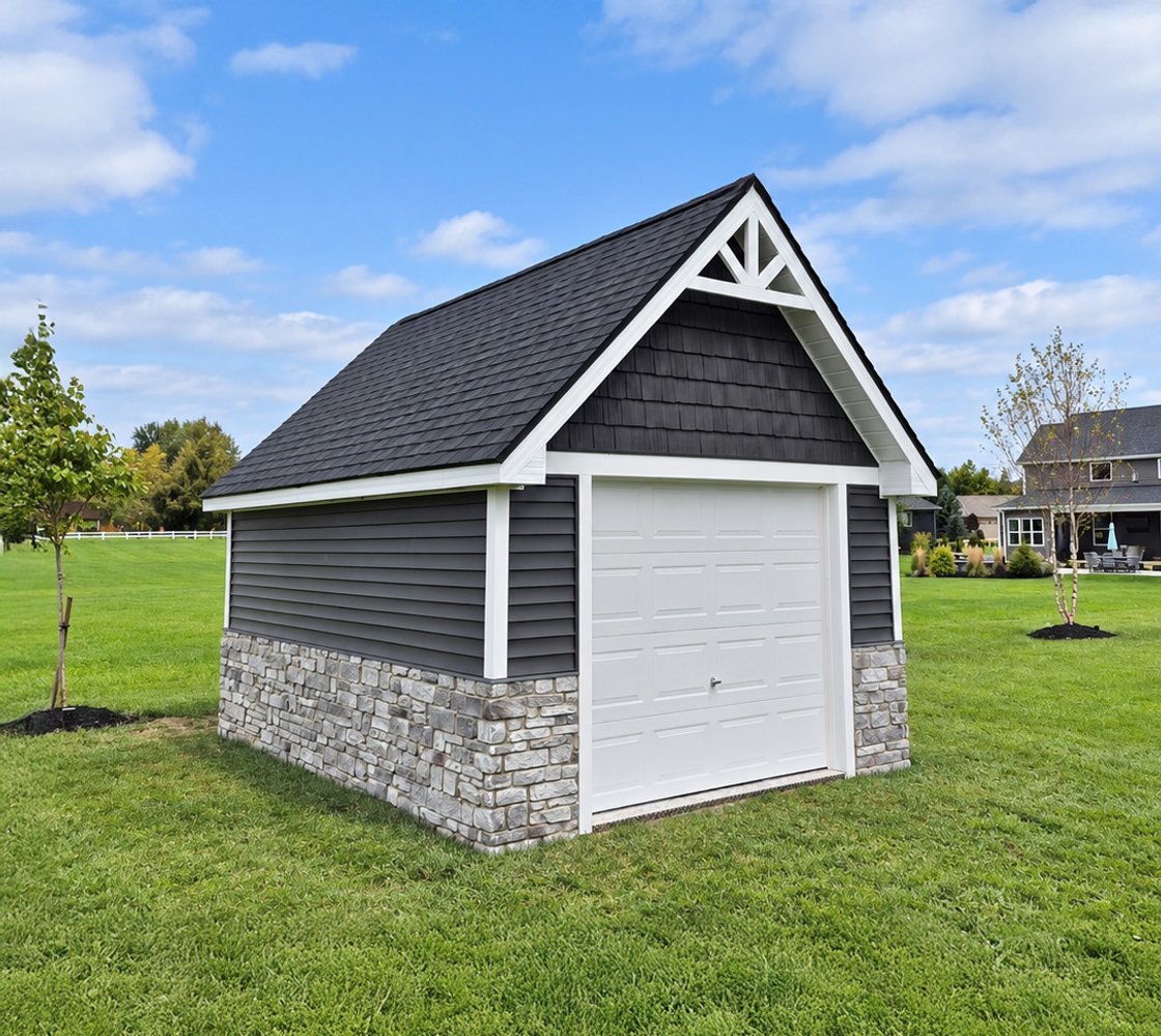 Amish-built garage with stone base by J&J Barns